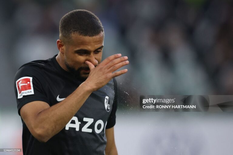 Freiburg's Ghanaian midfielder Daniel-Kofi Kyereh clears his nose during the German first division Bundesliga football match VfL Wolfsburg v SC Freiburg in Wolfsburg, northern Germany, on January 21, 2023. - - DFL REGULATIONS PROHIBIT ANY USE OF PHOTOGRAPHS AS IMAGE SEQUENCES AND/OR QUASI-VIDEO (Photo by Ronny HARTMANN / AFP) / DFL REGULATIONS PROHIBIT ANY USE OF PHOTOGRAPHS AS IMAGE SEQUENCES AND/OR QUASI-VIDEO (Photo by RONNY HARTMANN/AFP via Getty Images)