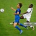 HANOVER, GERMANY - JUNE 12: Samuel Kuffour of Ghana thwarts the progress of Alberto Gilardino of Italy during the FIFA World Cup Germany 2006 Group E match between Italy and Ghana played at the Stadium Hanover on June 12, 2006 in Hanover, Germany. (Photo by Shaun Botterill/Getty Images)