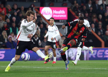 BOURNEMOUTH, ENGLAND - APRIL 14: Antoine Semenyo of AFC Bournemouth scores his team's first goal whilst under pressure from Joachim Andersen of Fulham during the Premier League match between AFC Bournemouth and Fulham FC at Vitality Stadium on April 14, 2025 in Bournemouth, England. (Photo by Michael Steele/Getty Images)