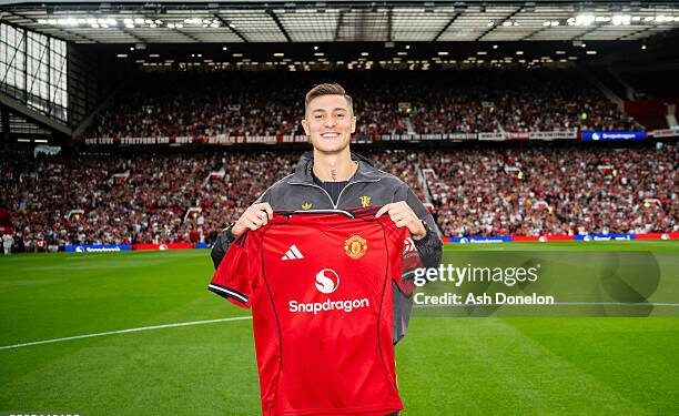 MANCHESTER, ENGLAND - AUGUST 9:   New Manchester United signing Benjamin Sesko poses with a team shirt prior to the pre-season friendly match between Manchester United and ACF Fiorentina at Old Trafford on August 9, 2025 in Manchester, England. (Photo by Ash Donelon/Manchester United via Getty Images)