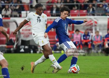 TOYOTA, JAPAN - NOVEMBER 14:  Francis Abu of Ghana breaks his leg as he is kicked by Ao Tanaka of Japan during the international friendly match between Japan and Ghana at Toyota Stadium on November 14, 2025 in Toyota, Aichi, Japan. (Photo by Etsuo Hara/Getty Images)
