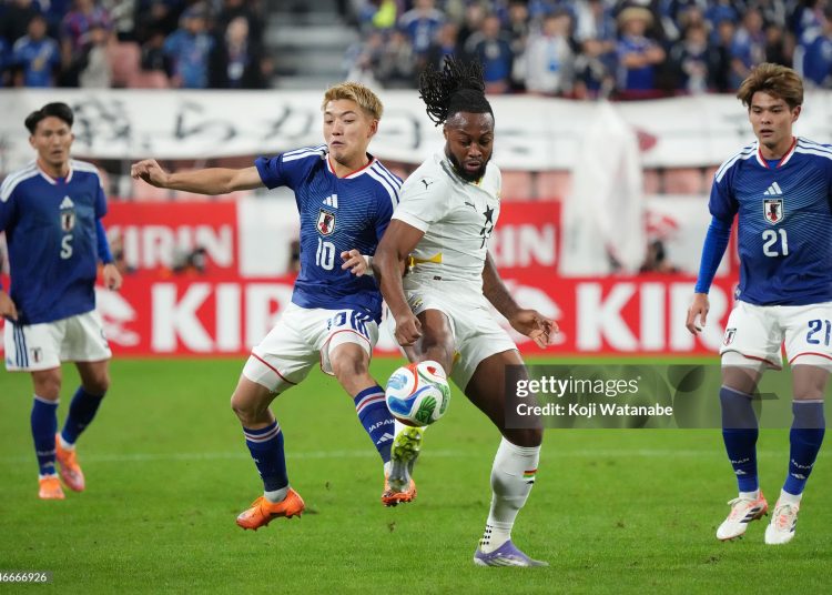 TOYOTA, JAPAN - NOVEMBER 14: Ritsu Doan of Japan (L) and Antoine Semenyo of Ghana (R) compete for the ball during the international friendly match between Japan and Ghana at Toyota Stadium on November 14, 2025 in Toyota, Aichi, Japan. (Photo by Koji Watanabe/Getty Images)
