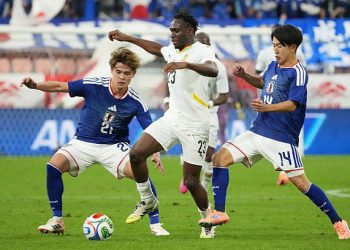 TOYOTA, JAPAN - NOVEMBER 14: Kwabena Adu Prince of Ghana (C) controls the ball against Ryunosuke Sato of Japan (R) during the international friendly match between Japan and Ghana at Toyota Stadium on November 14, 2025 in Toyota, Aichi, Japan. (Photo by Koji Watanabe/Getty Images)