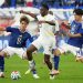 TOYOTA, JAPAN - NOVEMBER 14: Kwabena Adu Prince of Ghana (C) controls the ball against Ryunosuke Sato of Japan (R) during the international friendly match between Japan and Ghana at Toyota Stadium on November 14, 2025 in Toyota, Aichi, Japan. (Photo by Koji Watanabe/Getty Images)