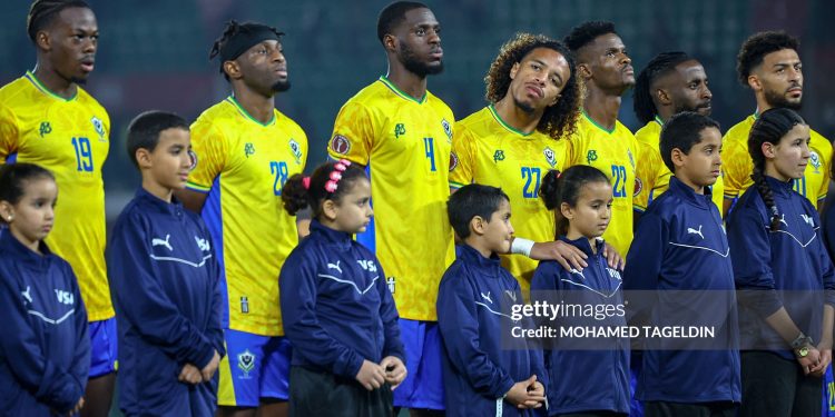 Gabon national team players during the national anthem before the match between Cameroon vs Gabon in the African Cup of Nations 2025 - Group F at Grand Stade D'Agadir , Agadir, Morocco (Photo by Mohamed Tageldin / Middle East Images / AFP via Getty Images)
