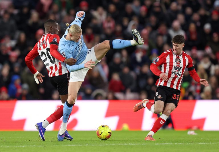 SUNDERLAND, ENGLAND - JANUARY 01: Erling Haaland of Manchester City battles for possession with Nordi Mukiele of Sunderland during the Premier League match between Sunderland and Manchester City at Stadium of Light on January 01, 2026 in Sunderland, England. (Photo by George Wood/Getty Images)