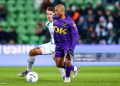 GRONINGEN, NETHERLANDS - JANUARY 10: Andre Ayew of NAC Breda is challenged by Stije Resink of FC Groningen during the Dutch Eredivisie match between FC Groningen and NAC Breda at Stadion Euroborg on January 10, 2026 in Groningen, Netherlands. (Photo by Pieter van der Woude/BSR Agency/Getty Images)