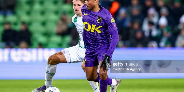 GRONINGEN, NETHERLANDS - JANUARY 10: Andre Ayew of NAC Breda is challenged by Stije Resink of FC Groningen during the Dutch Eredivisie match between FC Groningen and NAC Breda at Stadion Euroborg on January 10, 2026 in Groningen, Netherlands. (Photo by Pieter van der Woude/BSR Agency/Getty Images)