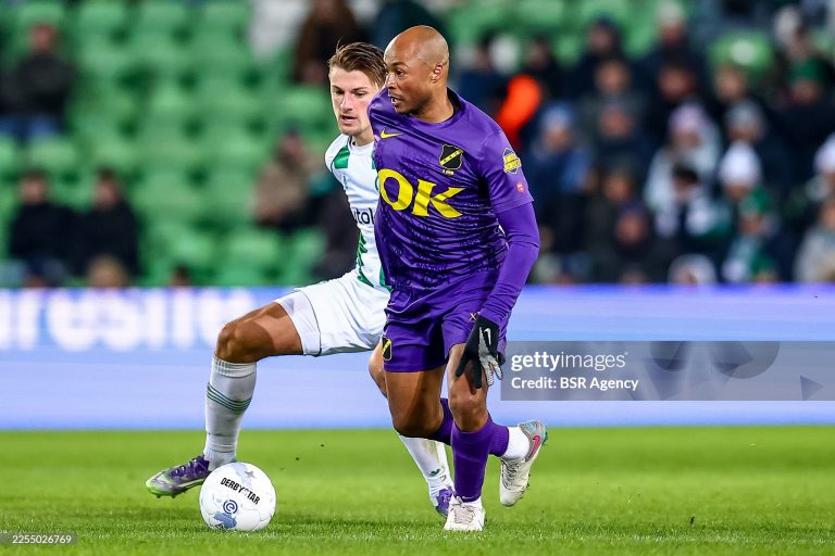GRONINGEN, NETHERLANDS - JANUARY 10: Andre Ayew of NAC Breda is challenged by Stije Resink of FC Groningen during the Dutch Eredivisie match between FC Groningen and NAC Breda at Stadion Euroborg on January 10, 2026 in Groningen, Netherlands. (Photo by Pieter van der Woude/BSR Agency/Getty Images)