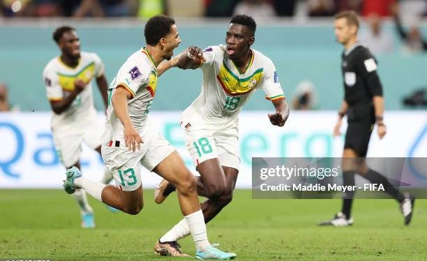 DOHA, QATAR - NOVEMBER 29: Ismaila Sarr of Senegal celebrates with Iliman Ndiaye after scoring their team’s first goal off a penalty during the FIFA World Cup Qatar 2022 Group A match between Ecuador and Senegal at Khalifa International Stadium on November 29, 2022 in Doha, Qatar. (Photo by Maddie Meyer - FIFA/FIFA via Getty Images)