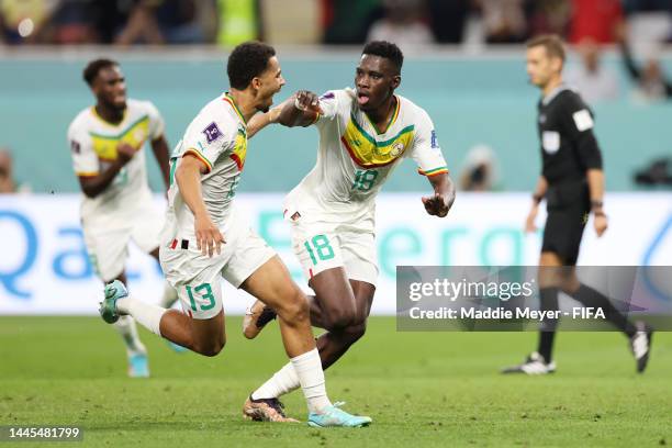 DOHA, QATAR - NOVEMBER 29: Ismaila Sarr of Senegal celebrates with Iliman Ndiaye after scoring their team’s first goal off a penalty during the FIFA World Cup Qatar 2022 Group A match between Ecuador and Senegal at Khalifa International Stadium on November 29, 2022 in Doha, Qatar. (Photo by Maddie Meyer - FIFA/FIFA via Getty Images)