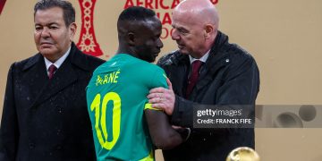 Senegal's forward #10 Sadio Mane speaks with FIFA President Gianni Infantino as Morocco's Prince Moulay Rachid looks on during presentation at the end of the Africa Cup of Nations (CAN) final football match between Senegal and Morocco at the Prince Moulay Abdellah Stadium in Rabat on January 18, 2026. (Photo by FRANCK FIFE / AFP via Getty Images)