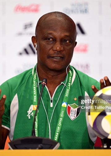 DOHA, QATAR - DECEMBER 06: James Kwesi Appiah, Head Coach of Sudan, speaks to the media in a post match press conference after the FIFA Arab Cup 2025 Group D match between Sudan and Iraq at Stadium 974 on December 06, 2025 in Doha, Qatar. (Photo by Tullio Puglia - FIFA/FIFA via Getty Images)