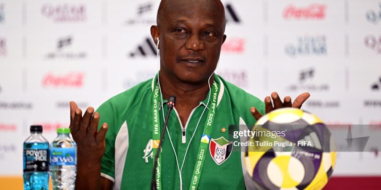 DOHA, QATAR - DECEMBER 06: James Kwesi Appiah, Head Coach of Sudan, speaks to the media in a post match press conference after the FIFA Arab Cup 2025 Group D match between Sudan and Iraq at Stadium 974 on December 06, 2025 in Doha, Qatar.  (Photo by Tullio Puglia - FIFA/FIFA via Getty Images)