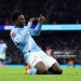 MANCHESTER, ENGLAND - JANUARY 10: Ryan McAidoo of Manchester City celebrates scoring his team's ninth goal during the Emirates FA Cup Third Round match between Manchester City and Exeter City at Etihad Stadium on January 10, 2026 in Manchester, England. (Photo by Mark Thompson/Getty Images)