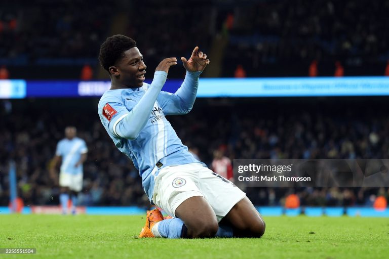 MANCHESTER, ENGLAND - JANUARY 10: Ryan McAidoo of Manchester City celebrates scoring his team's ninth goal during the Emirates FA Cup Third Round match between Manchester City and Exeter City at Etihad Stadium on January 10, 2026 in Manchester, England. (Photo by Mark Thompson/Getty Images)