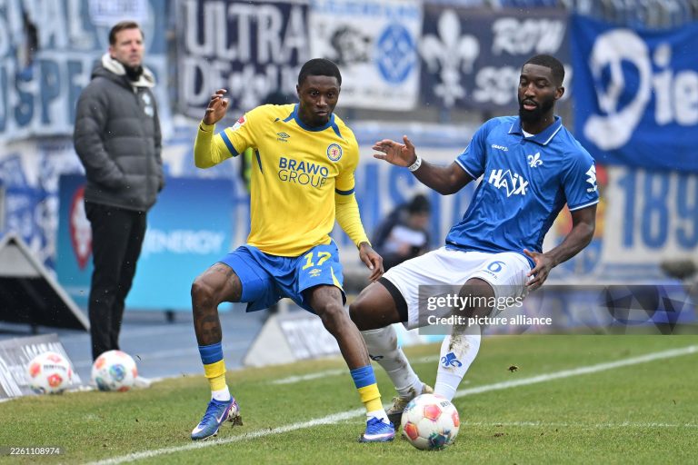 14 February 2026, Lower Saxony, Brunswick: Soccer: Bundesliga 2, Eintracht Braunschweig - Darmstadt 98, Matchday 22, Eintracht Stadium. Aaron Opoku (Eintracht Braunschweig) plays against Patric Pfeiffer (SV Darmstadt 98). Photo: Swen Pförtner/dpa - IMPORTANT NOTE: In accordance with the regulations of the DFL German Football League and the DFB German Football Association, it is prohibited to utilize or have utilized photographs taken in the stadium and/or of the match in the form of sequential images and/or video-like photo series. (Photo by Swen Pförtner/picture alliance via Getty Images)