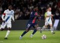 PARIS, FRANCE - MAY 17: Nuno Mendes of Paris Saint Germain (R) is chased by Elisha Owusu of Auxerre (L) during the France Ligue 1 match between Paris Saint-Germain FC and AJ Auxerre at Parc des Princes on May 17, 2025 in Paris, France. (Photo by Antonio Borga/Eurasia Sport Images/Getty Images)