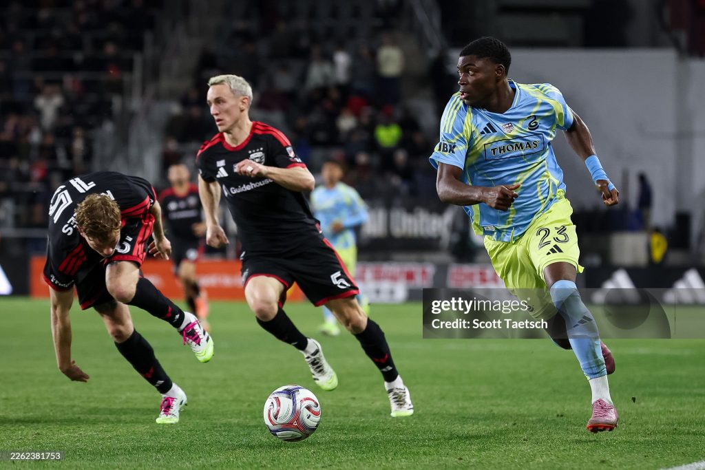 WASHINGTON, DC - FEBRUARY 21: Ezekiel Alladoh #23 of the Philadelphia Union kicks the ball in front of Silvan Hefti #5 of D.C. United during the second half of the match at Audi Field on February 21, 2026 in Washington, DC. (Photo by Scott Taetsch/Getty Images)