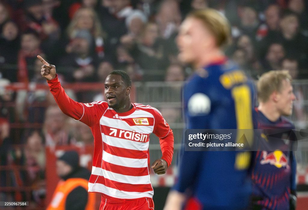 dpatop - 13 December 2025, Berlin: Soccer: Bundesliga, 1. FC Union Berlin - RB Leipzig, Matchday 14, An der Alten Försterei, Ilyas Ansah (1. FC Union Berlin) celebrates his goal to make it 2-1. Photo: Soeren Stache/dpa - IMPORTANT NOTE: In accordance with the regulations of the DFL German Football League and the DFB German Football Association, it is prohibited to utilize or have utilized photographs taken in the stadium and/or of the match in the form of sequential images and/or video-like photo series. (Photo by Soeren Stache/picture alliance via Getty Images)