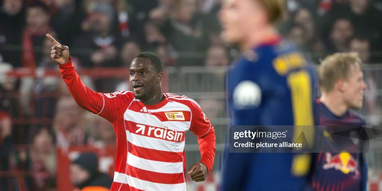 dpatop - 13 December 2025, Berlin: Soccer: Bundesliga, 1. FC Union Berlin - RB Leipzig, Matchday 14, An der Alten Försterei, Ilyas Ansah (1. FC Union Berlin) celebrates his goal to make it 2-1. Photo: Soeren Stache/dpa - IMPORTANT NOTE: In accordance with the regulations of the DFL German Football League and the DFB German Football Association, it is prohibited to utilize or have utilized photographs taken in the stadium and/or of the match in the form of sequential images and/or video-like photo series. (Photo by Soeren Stache/picture alliance via Getty Images)