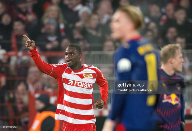 dpatop - 13 December 2025, Berlin: Soccer: Bundesliga, 1. FC Union Berlin - RB Leipzig, Matchday 14, An der Alten Försterei, Ilyas Ansah (1. FC Union Berlin) celebrates his goal to make it 2-1. Photo: Soeren Stache/dpa - IMPORTANT NOTE: In accordance with the regulations of the DFL German Football League and the DFB German Football Association, it is prohibited to utilize or have utilized photographs taken in the stadium and/or of the match in the form of sequential images and/or video-like photo series. (Photo by Soeren Stache/picture alliance via Getty Images)