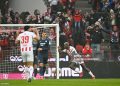 FC Cologne's German forward #09 Ragnar Ache (R) celebrates his 1-0 during the German first division Bundesliga football match 1 FC Cologne v TSG 1899 Hoffenheim in Cologne, western Germany, on February 21, 2026. (Photo by INA FASSBENDER / AFP via Getty Images) / DFL REGULATIONS PROHIBIT ANY USE OF PHOTOGRAPHS AS IMAGE SEQUENCES AND/OR QUASI-VIDEO