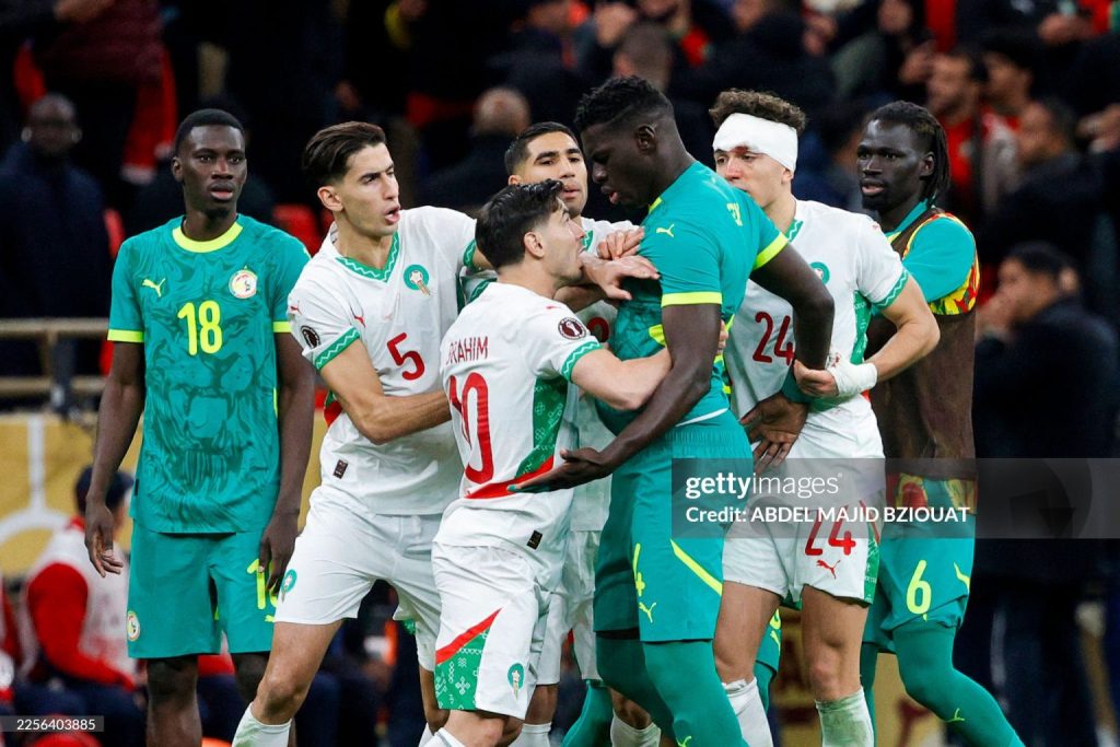 Senegal and Morocco players clash during the Africa Cup of Nations (CAN) final football match between Senegal and Morocco (Photo by Abdel Majid BZIOUAT / AFP via Getty Images)