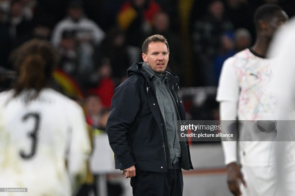 30 March 2026, Baden-Württemberg, Stuttgart: Soccer, men, international matches, Germany - Ghana, MHP Arena. Germany coach Julian Nagelsmann follows the match. Photo: Federico Gambarini/dpa - IMPORTANT NOTE: In accordance with the regulations of the DFL German Football League and the DFB German Football Association, it is prohibited to utilize or have utilized photographs taken in the stadium and/or of the match in the form of sequential images and/or video-like photo series. (Photo by Federico Gambarini/picture alliance via Getty Images)
