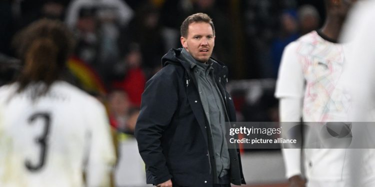 30 March 2026, Baden-Württemberg, Stuttgart: Soccer, men, international matches, Germany - Ghana, MHP Arena. Germany coach Julian Nagelsmann follows the match. Photo: Federico Gambarini/dpa - IMPORTANT NOTE: In accordance with the regulations of the DFL German Football League and the DFB German Football Association, it is prohibited to utilize or have utilized photographs taken in the stadium and/or of the match in the form of sequential images and/or video-like photo series. (Photo by Federico Gambarini/picture alliance via Getty Images)