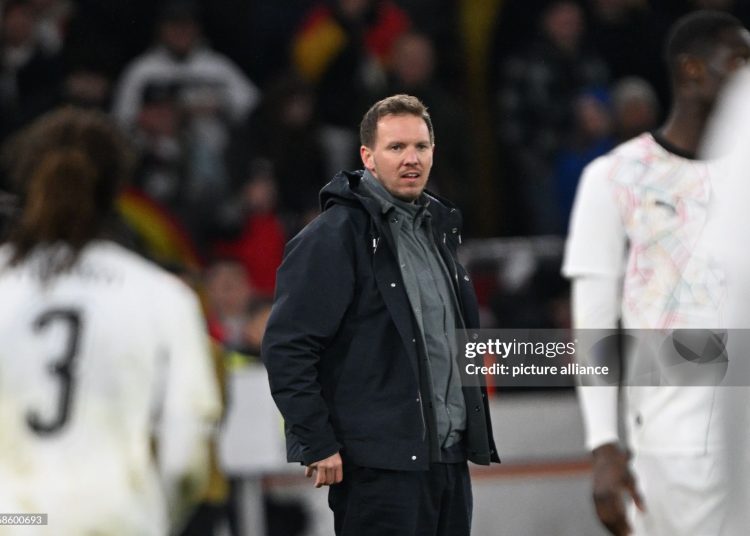 30 March 2026, Baden-Württemberg, Stuttgart: Soccer, men, international matches, Germany - Ghana, MHP Arena. Germany coach Julian Nagelsmann follows the match. Photo: Federico Gambarini/dpa - IMPORTANT NOTE: In accordance with the regulations of the DFL German Football League and the DFB German Football Association, it is prohibited to utilize or have utilized photographs taken in the stadium and/or of the match in the form of sequential images and/or video-like photo series. (Photo by Federico Gambarini/picture alliance via Getty Images)