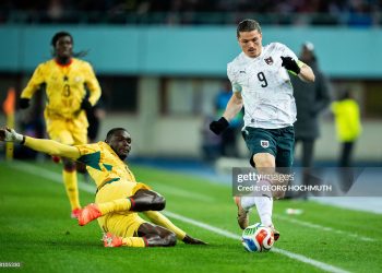 Ghana's midfielder #04 Jonas Adjetey (C) and Austria's forward #09 Marcel Sabitzer (R) vie for the ball during the friendly football match Austria vs Ghana in Vienna, Austria, on March 27, 2026. (Photo by GEORG HOCHMUTH / APA / AFP via Getty Images) / Austria OUT