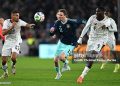 LUDWIGSBURG, GERMANY - MARCH 30: Nick Woltemade of Germany battles for the ball with Alexander Djiku and Jonas Adjetey of Ghana during the international friendly match between Germany and Ghana at MHP Arena on March 30, 2026 in Ludwigsburg, Germany. (Photo by Christian Kaspar-Bartke/Getty Images)