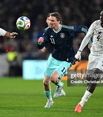 LUDWIGSBURG, GERMANY - MARCH 30: Nick Woltemade of Germany battles for the ball with Alexander Djiku and Jonas Adjetey of Ghana during the international friendly match between Germany and Ghana at MHP Arena on March 30, 2026 in Ludwigsburg, Germany. (Photo by Christian Kaspar-Bartke/Getty Images)