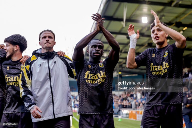 DOETINCHEM, NETHERLANDS - MARCH 8: (L-R) Yuval Ranon of Vitesse, Alexander Buttner of Vitesse, Solomon Bonnah of Vitesse, Adam Tahaui of Vitesse celebrating the victory after the match  during the Dutch Keuken Kampioen Divisie  match between De Graafschap v Vitesse at the De Vijverberg on March 8, 2026 in Doetinchem Netherlands (Photo by Jeroen van den Berg/Soccrates/Getty Images)