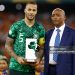 TOPSHOT - Nigeria's defender #5 William Troost-Ekong holds the Golden Ball award while standing next to President of the Confederation of African Football (CAF) Patrice Motsepe (R) during prize giving ceremony following the Africa Cup of Nations (CAN) 2024 final football match between Ivory Coast and Nigeria at Alassane Ouattara Olympic Stadium in Ebimpe, Abidjan on February 11, 2024. (Photo by Daniel BELOUMOU OLOMO / AFP) (Photo by DANIEL BELOUMOU OLOMO/AFP via Getty Images)