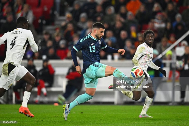 30 March 2026, Baden-Württemberg, Stuttgart: Soccer, Men, International match, Germany - Ghana, MHP Arena. Deniz Undav (M, Germany) gets the ball against Caleb Yirenkyi (r, Ghana) and Jonas Adjetey (Ghana). Photo: Tom Weller/dpa - IMPORTANT NOTE: In accordance with the regulations of the DFL German Football League and the DFB German Football Association, it is prohibited to utilize or have utilized photographs taken in the stadium and/or of the match in the form of sequential images and/or video-like photo series. (Photo by Tom Weller/picture alliance via Getty Images)