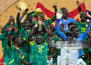 TOPSHOT - Senegal's forward #10 Sadio Mane holds the trophy after the Africa Cup of Nations (CAN) final football match between Senegal and Morocco at the Prince Moulay Abdellah Stadium in Rabat on January 18, 2026. (Photo by SEBASTIEN BOZON / AFP via Getty Images)