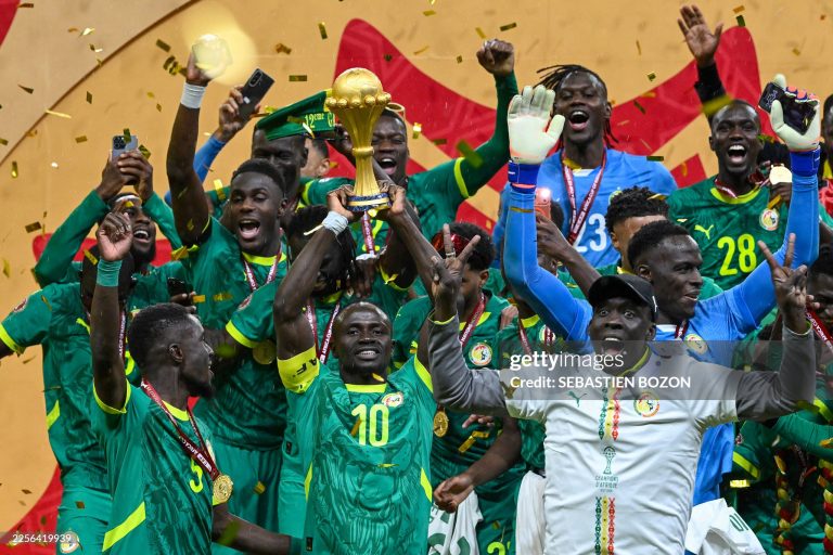 TOPSHOT - Senegal's forward #10 Sadio Mane holds the trophy after the Africa Cup of Nations (CAN) final football match between Senegal and Morocco at the Prince Moulay Abdellah Stadium in Rabat on January 18, 2026. (Photo by SEBASTIEN BOZON / AFP via Getty Images)