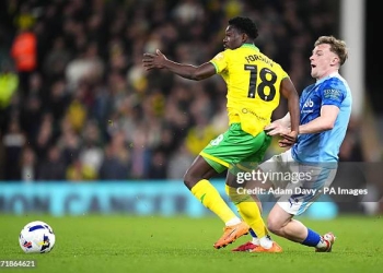 Norwich City's Forson Amankwah (left) and Derby County's Derry Murkin battle for the ball during the Sky Bet Championship match at Carrow Road, Norwich. Picture date: Tuesday April 21, 2026. (Photo by Adam Davy/PA Images via Getty Images)