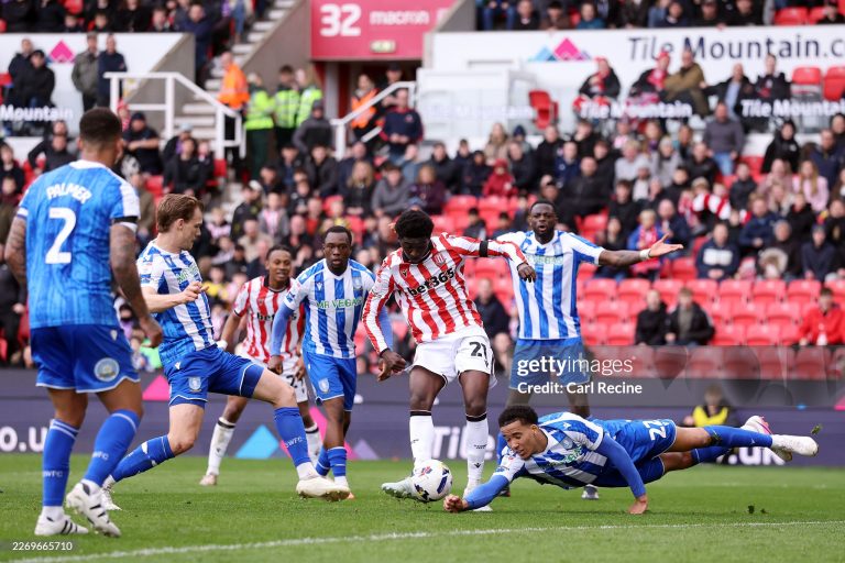 STOKE ON TRENT, ENGLAND - APRIL 03: Gabriel Otegbayo of Sheffield Wednesday dives as he attempts to block the shot from Jesurun Rak-Sakyi of Stoke City during the Sky Bet Championship match between Stoke City and Sheffield Wednesday at Bet365 Stadium on April 03, 2026 in Stoke on Trent, England. (Photo by Carl Recine/Getty Images)