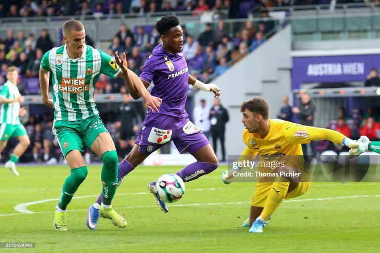 VIENNA, AUSTRIA - APRIL 12: Kelvin Boateng of Austria Wien competes with Nenad Cvetkovic and goalkeeper Niklas Hedl of Rapid during the Admiral Bundesliga match between  FK Austria Wien and SK Rapid at Generali Arena on April 12, 2026 in Vienna, Austria. (Photo by Thomas Pichler/SEPA.Media /Getty Images)