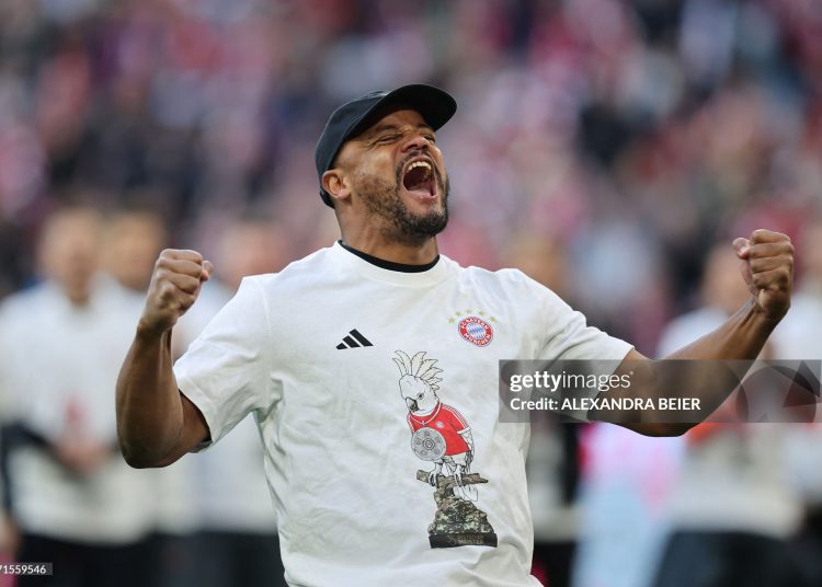 TOPSHOT - Bayern Munich's Belgian head coach Vincent Kompany celebrates after the German first division Bundesliga football match between FC Bayern Munich and VfB Stuttgart in Munich, southern Germany, on April 19, 2026. Harry Kane scored his 32nd goal of the campaign as Bayern Munich cruised to a 4-2 home win over Stuttgart and claim a record-extending 35th Bundesliga title. (Photo by Alexandra BEIER / AFP via Getty Images) / DFL REGULATIONS PROHIBIT ANY USE OF PHOTOGRAPHS AS IMAGE SEQUENCES AND/OR QUASI-VIDEO