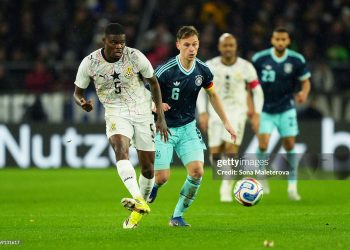 STUTTGART, GERMANY - MARCH 30: Thomas Partey of Ghana passes the ball while under pressure from Joshua Kimmich of Germany during the international friendly match between Germany and Ghana at MHP Arena on March 30, 2026 in Stuttgart, Germany. (Photo by Sona Maleterova/Getty Images)