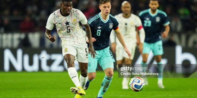 STUTTGART, GERMANY - MARCH 30: Thomas Partey of Ghana passes the ball while under pressure from Joshua Kimmich of Germany during the international friendly match between Germany and Ghana at MHP Arena on March 30, 2026 in Stuttgart, Germany. (Photo by Sona Maleterova/Getty Images)