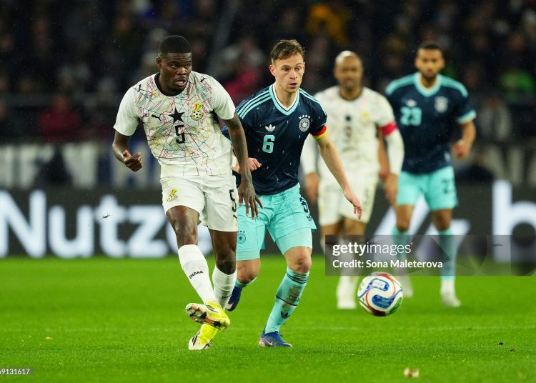 STUTTGART, GERMANY - MARCH 30: Thomas Partey of Ghana passes the ball while under pressure from Joshua Kimmich of Germany during the international friendly match between Germany and Ghana at MHP Arena on March 30, 2026 in Stuttgart, Germany. (Photo by Sona Maleterova/Getty Images)