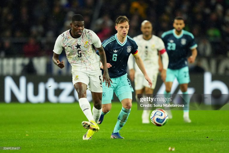 STUTTGART, GERMANY - MARCH 30: Thomas Partey of Ghana passes the ball while under pressure from Joshua Kimmich of Germany during the international friendly match between Germany and Ghana at MHP Arena on March 30, 2026 in Stuttgart, Germany. (Photo by Sona Maleterova/Getty Images)