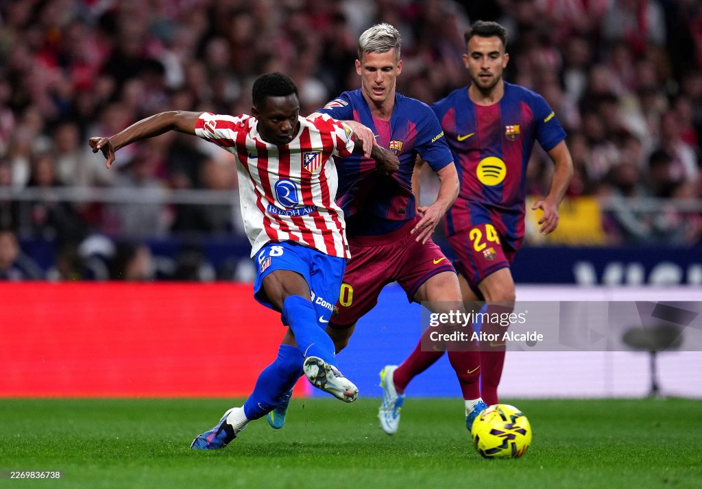 MADRID, SPAIN - APRIL 04: Taufik Seidu of Atletico de Madrid is challenged by Dani Olmo of FC Barcelona during the LaLiga EA Sports match between Atletico de Madrid and FC Barcelona at Riyadh Air Metropolitano on April 04, 2026 in Madrid, Spain. (Photo by Aitor Alcalde/Getty Images)