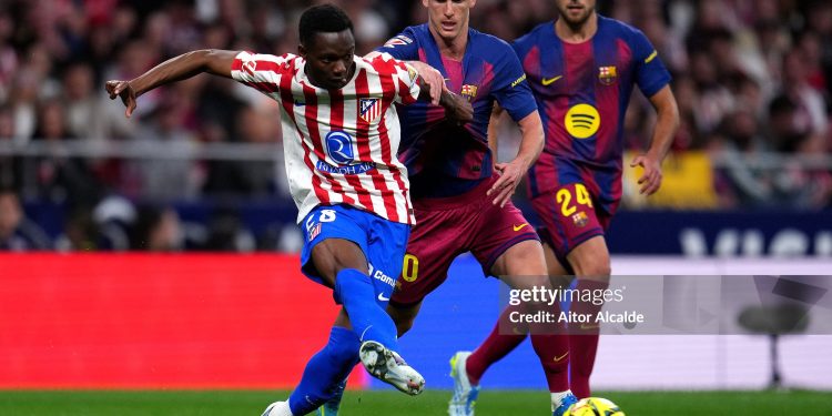 MADRID, SPAIN - APRIL 04: Taufik Seidu of Atletico de Madrid is challenged by Dani Olmo of FC Barcelona during the LaLiga EA Sports match between Atletico de Madrid and FC Barcelona at Riyadh Air Metropolitano on April 04, 2026 in Madrid, Spain. (Photo by Aitor Alcalde/Getty Images)
