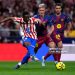 MADRID, SPAIN - APRIL 04: Taufik Seidu of Atletico de Madrid is challenged by Dani Olmo of FC Barcelona during the LaLiga EA Sports match between Atletico de Madrid and FC Barcelona at Riyadh Air Metropolitano on April 04, 2026 in Madrid, Spain. (Photo by Aitor Alcalde/Getty Images)